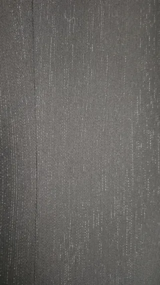 Americana negra con hilo metalizado