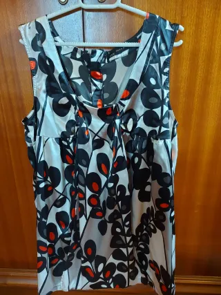 Blusa sin mangas con cremallera