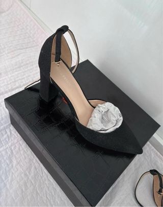 Décolleté nere con cinturino