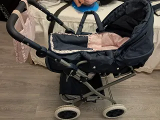 Cochecito de juguete azul