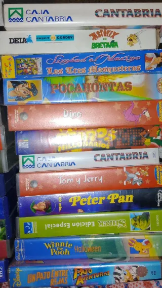 Lote de 30 películas VHS + reproductor de DVD