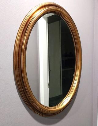 Specchio ovale con cornice oro antico