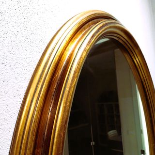 Specchio ovale con cornice oro antico