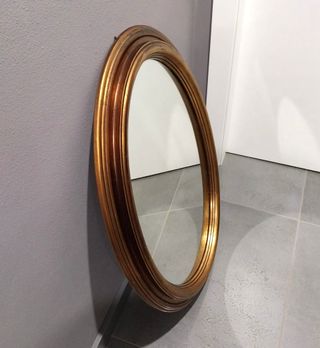 Specchio ovale con cornice oro antico