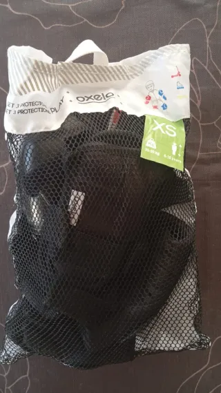 Monopatín naranja con protecciones nuevas XS