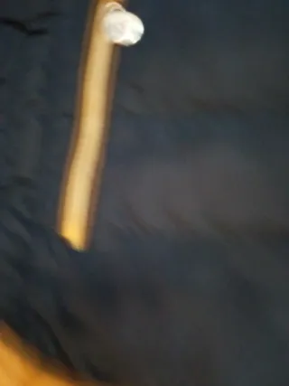 Chaqueta corta de plumas azul mujer