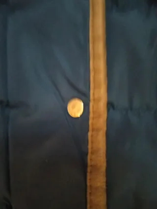 Chaqueta corta de plumas azul mujer