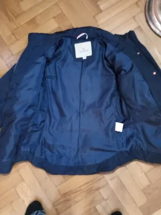 Chaqueta corta de plumas azul mujer