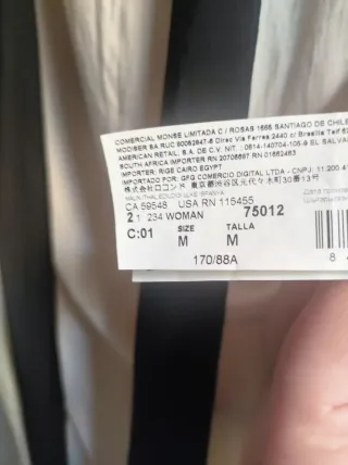 Blusa beige cuello negro