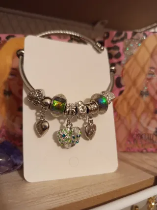 Pulsera de acero con charms