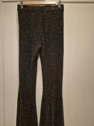 Pantalones campana metalizados negros y plateados