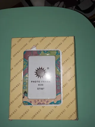 Cornice portafoto in ceramica