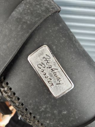 Bolso redondo cuero negro y plata