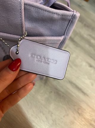 Original Bolso Coach Lila Medio con cinturón