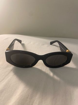 Occhiali da sole Miu Miu neri e oro