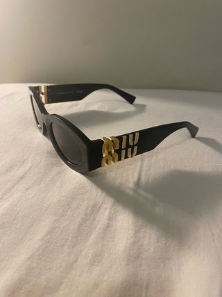 Occhiali da sole Miu Miu neri e oro