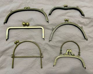 Bocchette dorate per borse