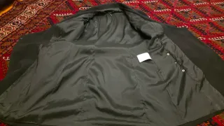 Cappottino nero con dettagli