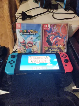 Nintendo Switch + Custodia + 3 Giochi + Archiviazione