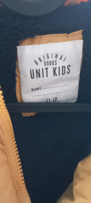 Giubbotto imbottito giallo per bambini. Taglia 11-12