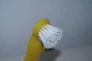 Saboneteira e escova de golfinho amarela