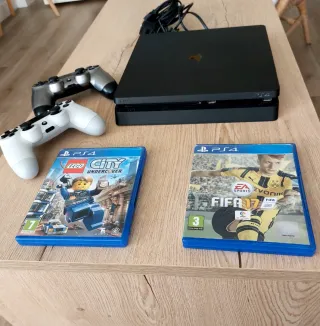 PS4 (PlayStation 4) con 2 mandos y 2 juegos
