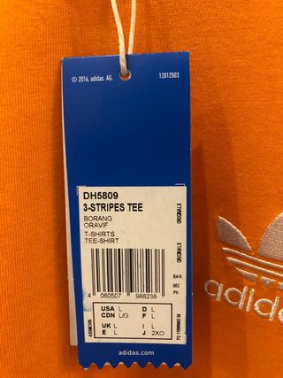 Camiseta Adidas Naranja Rayas Blancas . Nuevo.