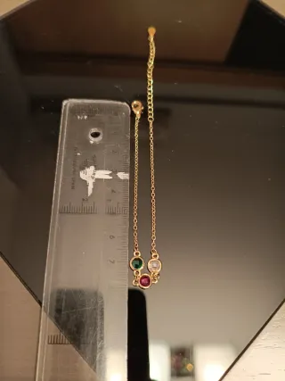 Pulsera de oro con 3 piedras