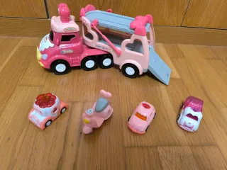 Camión de juguete rosa con accesorios