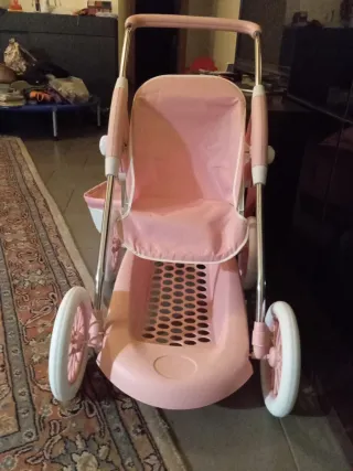 Cochecito de juguete rosa