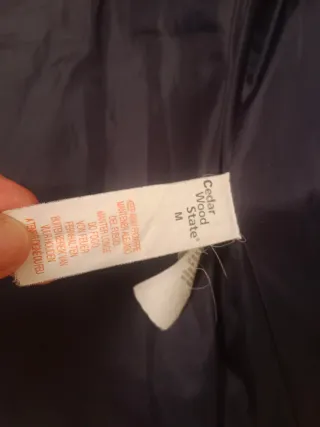 Chaleco acolchado azul con capucha. Azul marino