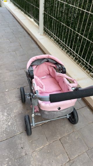 Cochecito de juguete rosa y gris