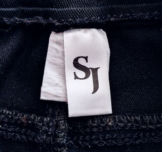 Jeans SJ neri ricamo Mickey Mouse