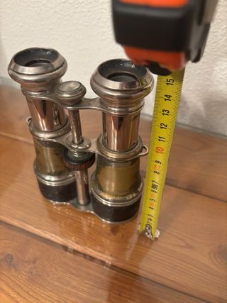 Prismáticos antiguos plateados y dorados