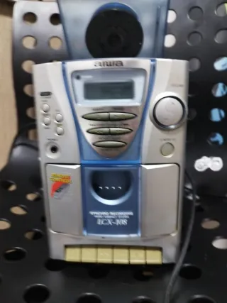 Minicade aiwa plateada