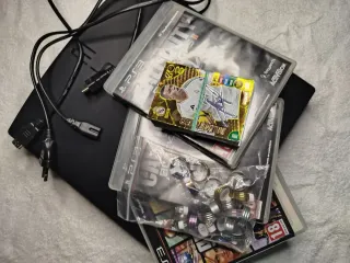 OFFERTA!! PS3 Slim Nera + Giochi e Accessori