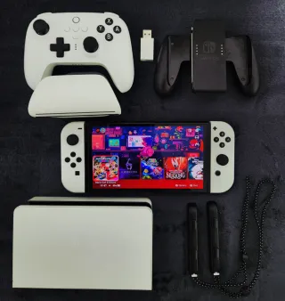 Nintendo Switch OLED + 54 Giochi