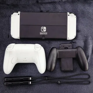 Nintendo Switch OLED + 54 Giochi