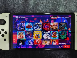 Nintendo Switch OLED + 54 Giochi