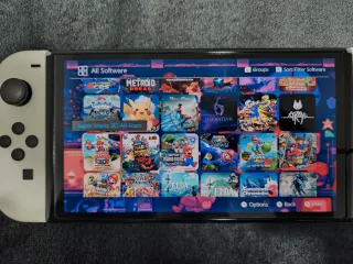 Nintendo Switch OLED + 54 Giochi