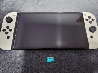 Nintendo Switch OLED + 54 Giochi