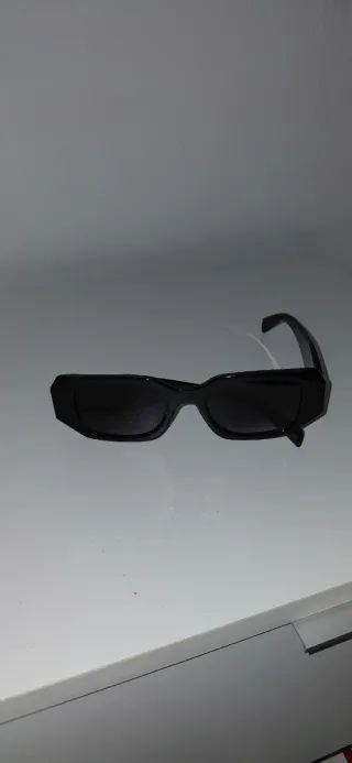 Gafas de sol Prada negras dorada Tratable