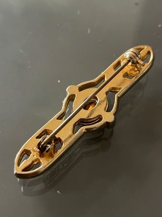 Spilla vintage metallo dorato lavorato con pietre