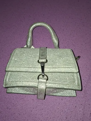 Mini bolso fiesta plateado. H&M