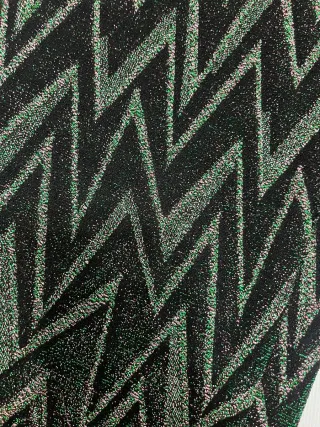 Mono fiesta plateado negro con tonos verdes