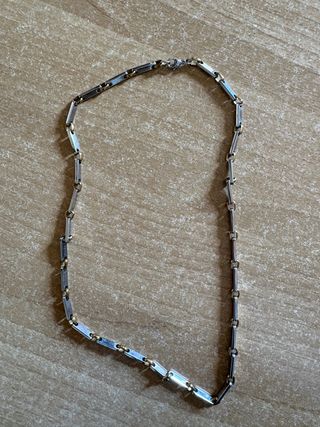 Collana acciaio maglie dorate