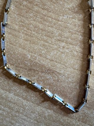 Collana acciaio maglie dorate