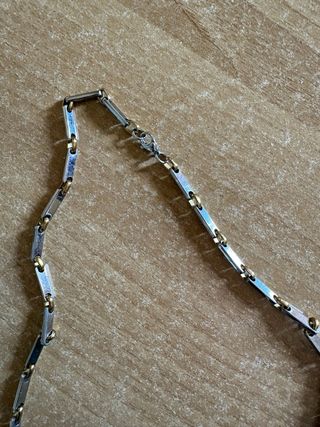 Collana acciaio maglie dorate