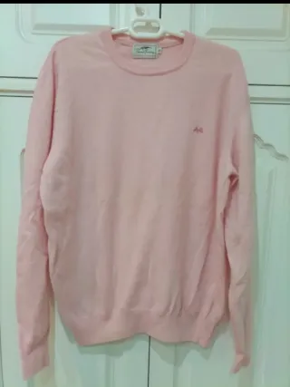 Chaqueta Lacoste Negra y jersey Thomas Burberry