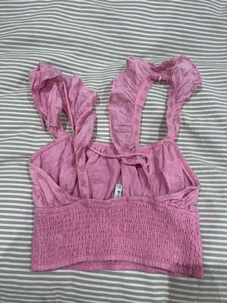 Top rosa Stradivarius con volantes